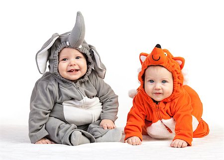 simsearch:400-07329323,k - Two baby boys dressed in animal costumes over white Foto de stock - Royalty-Free Super Valor e Assinatura, Número: 400-07326140