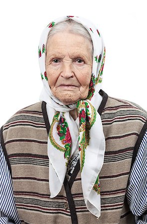 sad grandmother - Portrait of a senior woman in headscarf looking at the camera. Over white background. Stock Photo - Budget Royalty-Free & Subscription, Code: 400-07326152