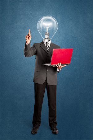 Idea concept. Lamp head business man shows something with his finger Stock Photo - Budget Royalty-Free & Subscription, Code: 400-07326960