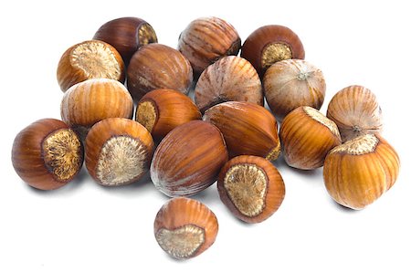 simsearch:400-06520688,k - Fistful of brown hazel nuts isolated with white background Stock Photo - Budget Royalty-Free & Subscription, Code: 400-07326990