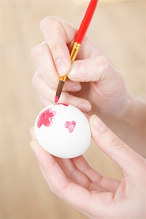close up of female hands painting white egg with brush Stock Photo - Budget Royalty-Free & Subscription, Code: 400-07327379