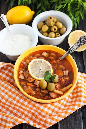 stew sausage - Solyanka - russian soup with meat, sausage, olives and lemon Stock Photo - Budget Royalty-Free & Subscription, Code: 400-07328048
