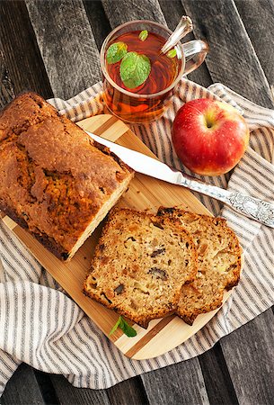 Apple nut cake and  cup of tea on wooden table Photographie de stock - Aubaine LD & Abonnement, Code: 400-07328052