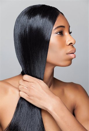 simsearch:400-06179308,k - Beautiful young black woman with long straight hair Stock Photo - Budget Royalty-Free & Subscription, Code: 400-07328384