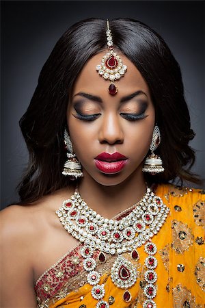 Young Indian woman dressed in traditional clothing with bridal makeup and jewelry Stock Photo - Budget Royalty-Free & Subscription, Code: 400-07328385