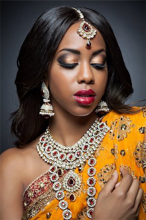 Young Indian woman dressed in traditional clothing with bridal makeup and jewelry Stock Photo - Budget Royalty-Free & Subscription, Code: 400-07328387