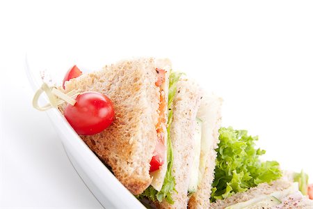 fresh tasty club sandwich with lettuce cheese ham and toast isolated on white background Stockbilder - Microstock & Abonnement, Bildnummer: 400-07328555