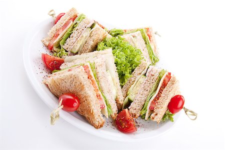fresh tasty club sandwich with lettuce cheese ham and toast isolated on white background Stock Photo - Budget Royalty-Free & Subscription, Code: 400-07328552