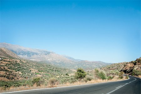 Driving North to South or the other way around on Crete, you will drive this road through the hills of Crete Stock Photo - Budget Royalty-Free & Subscription, Code: 400-07329226