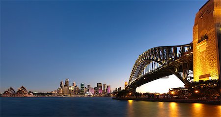simsearch:400-04502321,k - View of Sydney Harbour at dusk with the Harbour Bridge to the side Foto de stock - Super Valor sin royalties y Suscripción, Código: 400-07329961