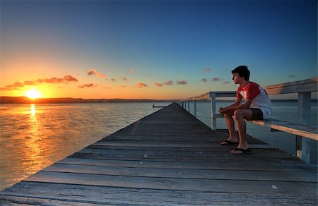 summer and pressure - Letting go of all lifes stresses and tensions, sitting quietly and watching the sunset  A peaceful soul makes life more loveable. Stock Photo - Budget Royalty-Free & Subscription, Code: 400-07320016