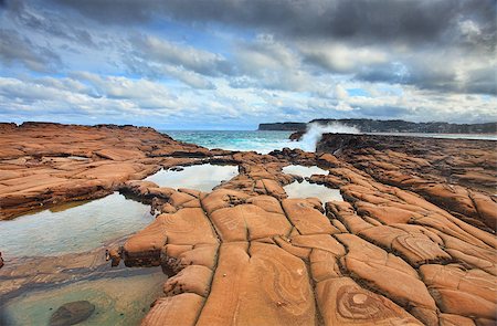 simsearch:400-07514503,k - Ocean waves splash against spectacularrock formations at North Avoca, NSW Australia, with serene rockpools in the foreground. Stock Photo - Budget Royalty-Free & Subscription, Code: 400-07320017