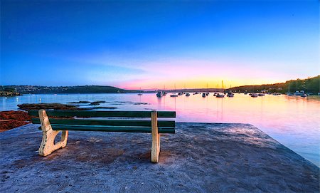 Come take a seat, watch the sunrise and admire the tranquil views of Balmoral, Australia.  Buyers note  long 22sec exp, some motion in boats etc Stock Photo - Budget Royalty-Free & Subscription, Code: 400-07320021
