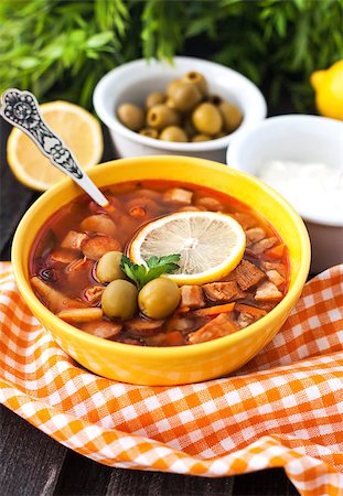 stew sausage - Solyanka - russian soup with meat, sausage, olives and lemon Stock Photo - Budget Royalty-Free & Subscription, Code: 400-07320818