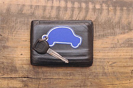 car keys and documents on dark wooden background Fotografie stock - Microstock e Abbonamento, Codice: 400-07320872