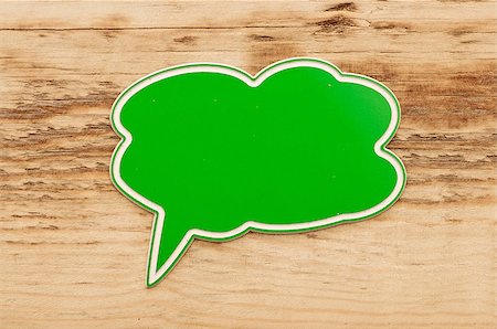 simsearch:400-08195370,k - green speech bubble on wood background Stock Photo - Budget Royalty-Free & Subscription, Code: 400-07320886