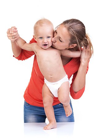 Baby boy learning to walk with mother's help over white Stock Photo - Budget Royalty-Free & Subscription, Code: 400-07320899