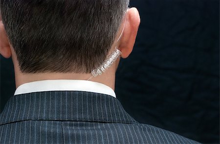 patrolling - Close-up of a secret service agent, behind. Stock Photo - Budget Royalty-Free & Subscription, Code: 400-07321222