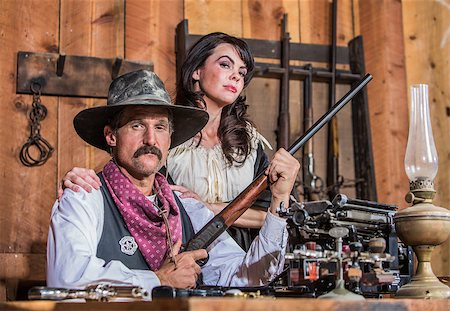 simsearch:400-07516134,k - Western Sheriff Poses With a Woman Stock Photo - Budget Royalty-Free & Subscription, Code: 400-07321490