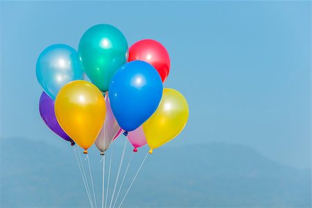 Bunch of colorful balloons in blue sky Foto de stock - Super Valor sin royalties y Suscripción, Código: 400-07321557