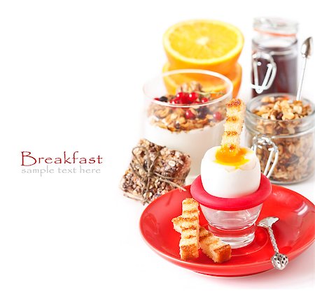 Fresh breakfast with boiled egg, toast, granola yogurt and coffee on a white. Stock Photo - Budget Royalty-Free & Subscription, Code: 400-07321595