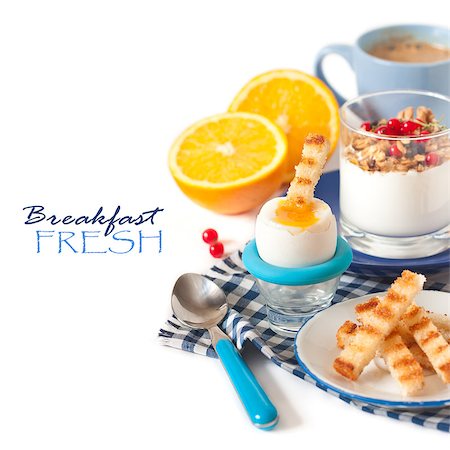 Fresh breakfast with boiled egg, toast, granola yogurt and coffee on a white. Stock Photo - Budget Royalty-Free & Subscription, Code: 400-07321592