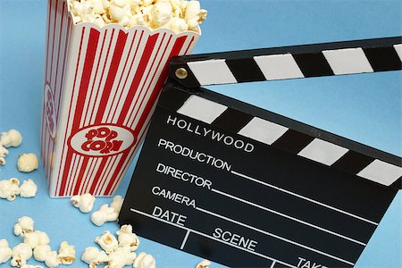 film making - A clean clapboard and popcorn to express the movie industry. Stock Photo - Budget Royalty-Free & Subscription, Code: 400-07322899