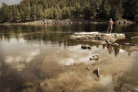A fisherman on shore in the good ole days. Stock Photo - Budget Royalty-Free & Subscription, Code: 400-07322900