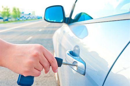 woman opens a door key of a new car Stock Photo - Budget Royalty-Free & Subscription, Code: 400-07323018