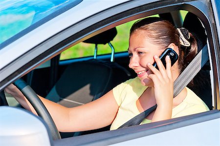 woman driving a car talking on the phone Stock Photo - Budget Royalty-Free & Subscription, Code: 400-07323057