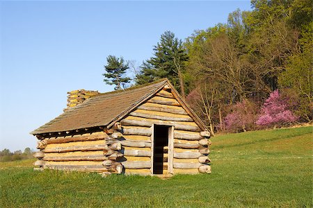 A reproduction of cabins used by Revolutionary War soldiers during the winter of 1777-78 under the command of George Washington. Located in Valley Forge National Historic Park, Pennsylvania, USA. Stockbilder - Microstock & Abonnement, Bildnummer: 400-07323361