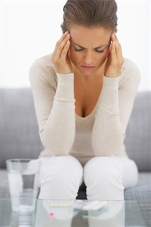 stressed housewife - Portrait of stressed young housewife in living room Stock Photo - Budget Royalty-Free & Subscription, Code: 400-07323595