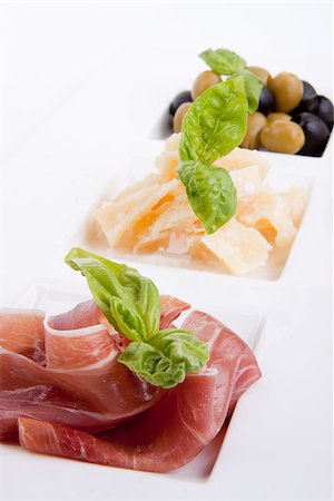 parma - deliscious antipasti plate with parma parmesan and olives isolated on white background Foto de stock - Super Valor sin royalties y Suscripción, Código: 400-07323832