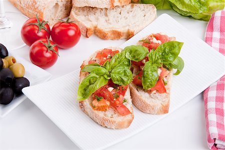 simsearch:400-06096133,k - deliscious fresh bruschetta appetizer with tomatoes isolated on white background Fotografie stock - Microstock e Abbonamento, Codice: 400-07323874