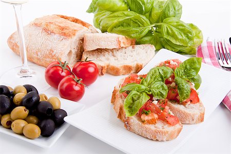 simsearch:400-06096133,k - deliscious fresh bruschetta appetizer with tomatoes isolated on white background Fotografie stock - Microstock e Abbonamento, Codice: 400-07323876