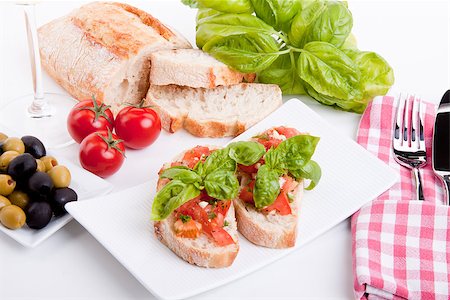 simsearch:400-06096133,k - deliscious fresh bruschetta appetizer with tomatoes isolated on white background Fotografie stock - Microstock e Abbonamento, Codice: 400-07323873