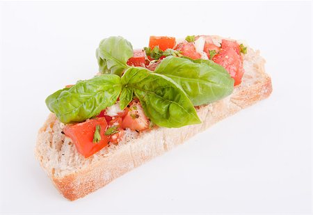 simsearch:400-06096133,k - deliscious fresh bruschetta appetizer with tomatoes isolated on white background Fotografie stock - Microstock e Abbonamento, Codice: 400-07323884