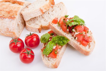 simsearch:400-06096133,k - deliscious fresh bruschetta appetizer with tomatoes isolated on white background Fotografie stock - Microstock e Abbonamento, Codice: 400-07323883