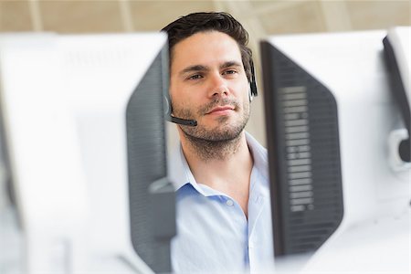 Male customer service representative using computer in call center Stock Photo - Budget Royalty-Free & Subscription, Code: 400-07334302