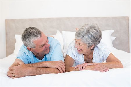 simsearch:400-07334704,k - Happy senior couple looking at each other in bed at home Stock Photo - Budget Royalty-Free & Subscription, Code: 400-07334647