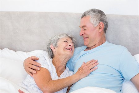 simsearch:400-07334704,k - Loving senior man looking at wife in bed at home Stock Photo - Budget Royalty-Free & Subscription, Code: 400-07334668