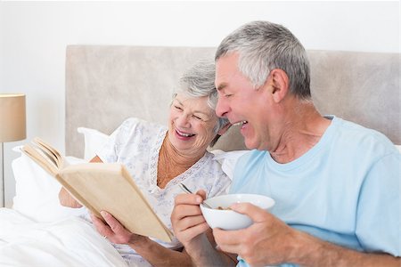 simsearch:400-07334704,k - Happy senior couple reading book in bed at home Stock Photo - Budget Royalty-Free & Subscription, Code: 400-07334683