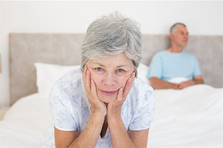 simsearch:400-07334704,k - Portrait of sad senior woman with husband in bed at home Stock Photo - Budget Royalty-Free & Subscription, Code: 400-07334709