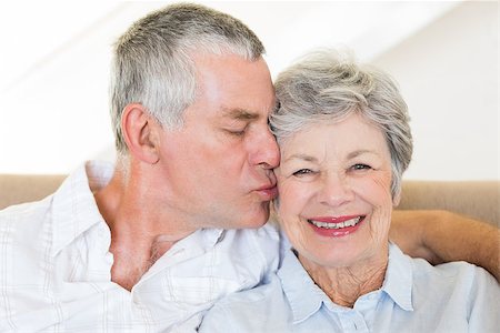 simsearch:400-07334704,k - Loving senior man kissing wife on cheeks at home Stock Photo - Budget Royalty-Free & Subscription, Code: 400-07334724