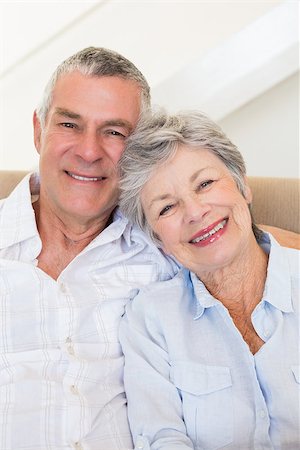 simsearch:400-04151970,k - Portrait of affectionate senior couple smiling together at home Fotografie stock - Microstock e Abbonamento, Codice: 400-07334731