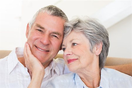 simsearch:400-04151970,k - Loving senior woman touching husband at home Fotografie stock - Microstock e Abbonamento, Codice: 400-07334732