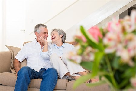 simsearch:400-04151970,k - Loving senior couple relaxing on sofa at home Fotografie stock - Microstock e Abbonamento, Codice: 400-07334733