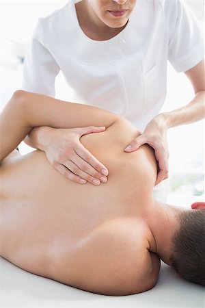 physical therapy shoulder - Professional female therapist giving shoulder massage to man in hospital Stock Photo - Budget Royalty-Free & Subscription, Code: 400-07335396
