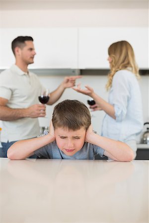 pictures of angry father and son - Irritated boy covering ears while parents arguing in background at home Stock Photo - Budget Royalty-Free & Subscription, Code: 400-07335534