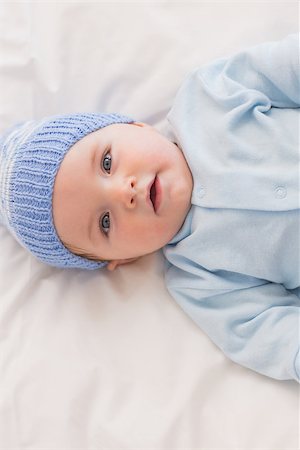 High angle portrait of innocent baby boy wearing knit hat in bed Stock Photo - Budget Royalty-Free & Subscription, Code: 400-07335768